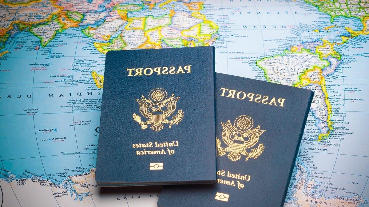 Two passports on a world map